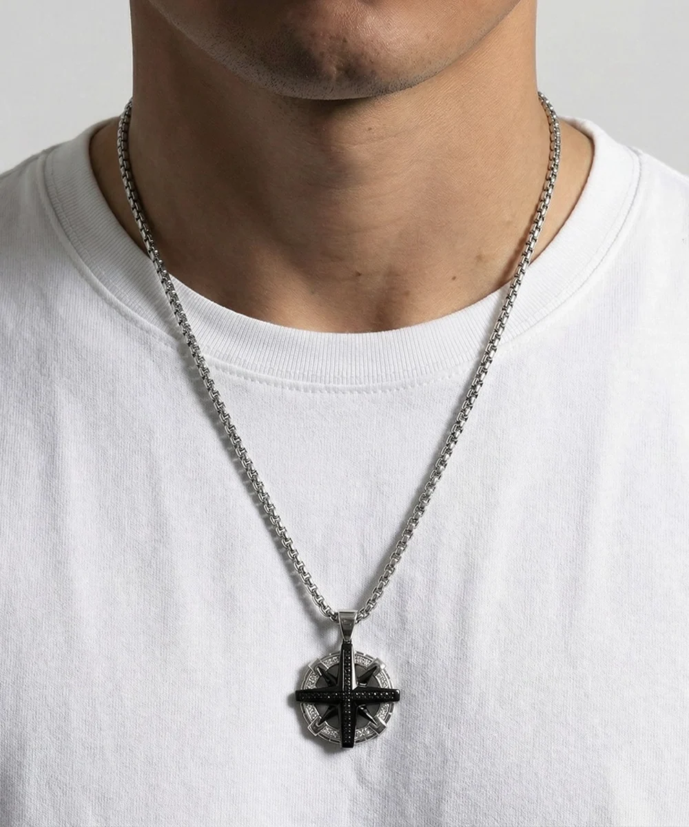 Close-up of black cubic zirconia compass pendant