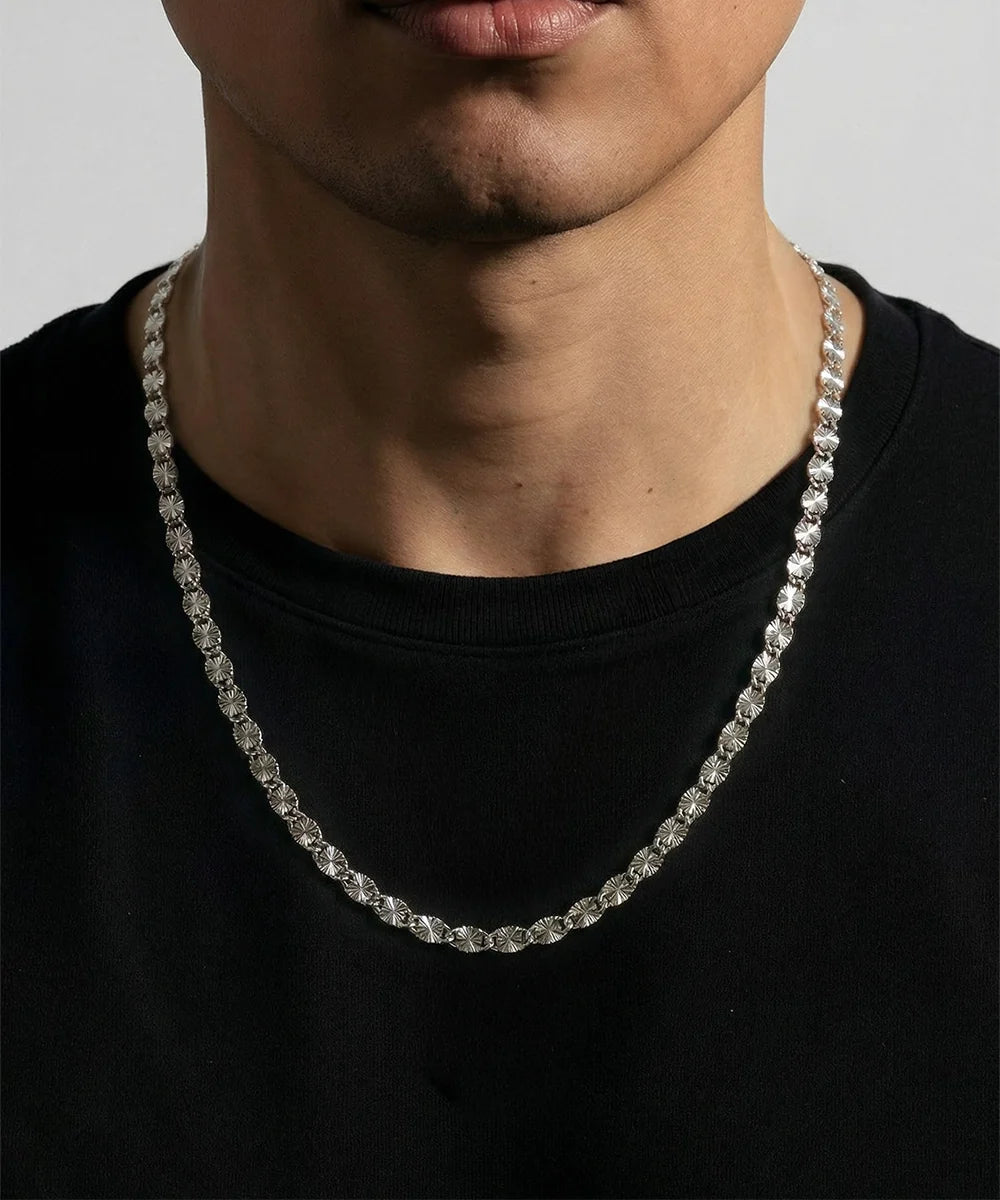 Close-up of Valentino D/C chain links