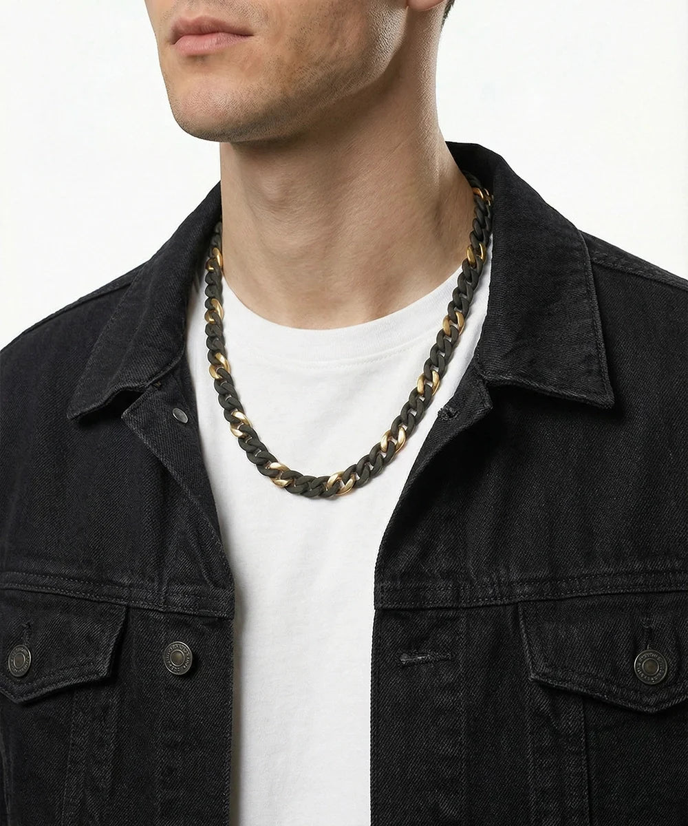 men's two-tone black and gold stainless steel curb chain necklace on model wearing black denim jacket
