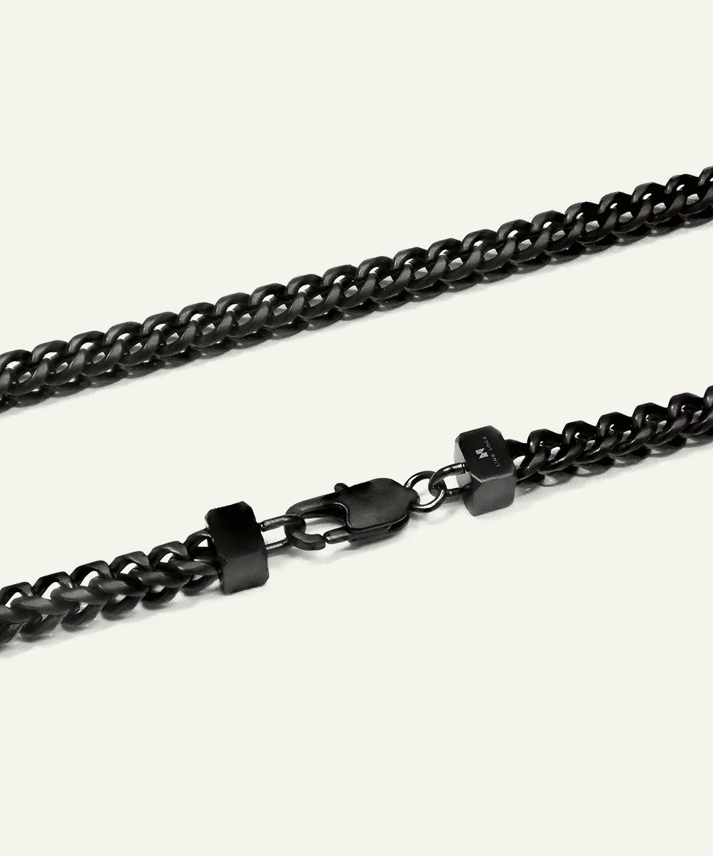 Black chain necklace on a white background
