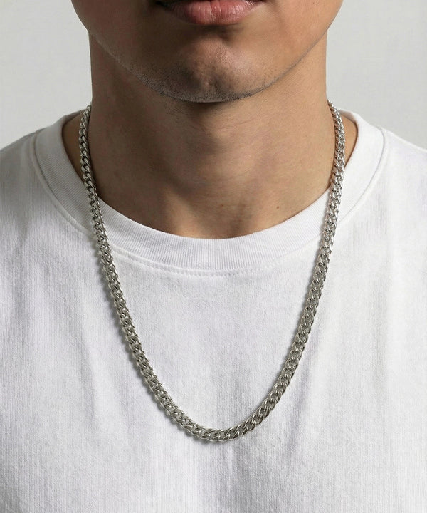 men's 24-inch silver-toned Cuban chain necklace on model wearing white t-shirt