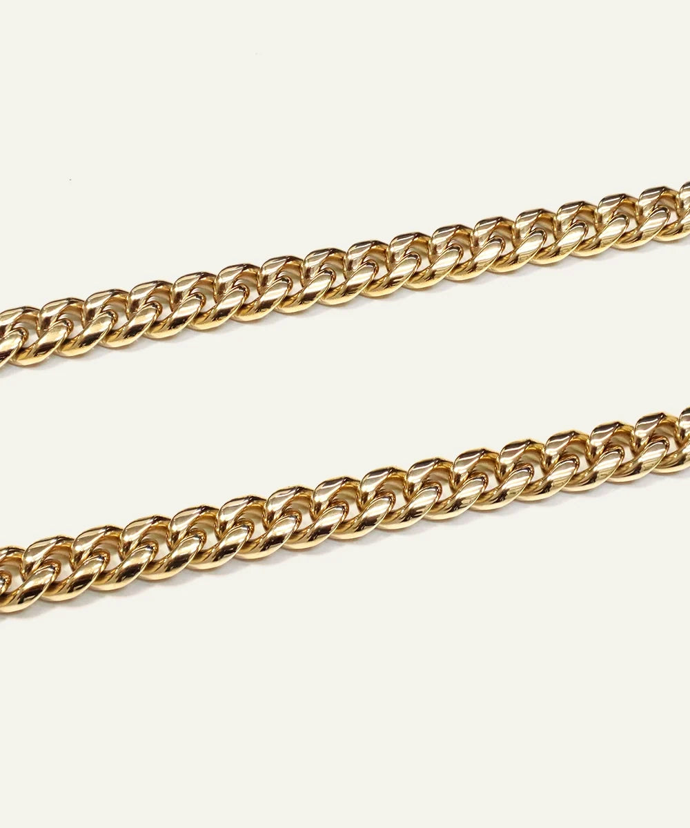 Close-up of gold-toned Cuban chain links