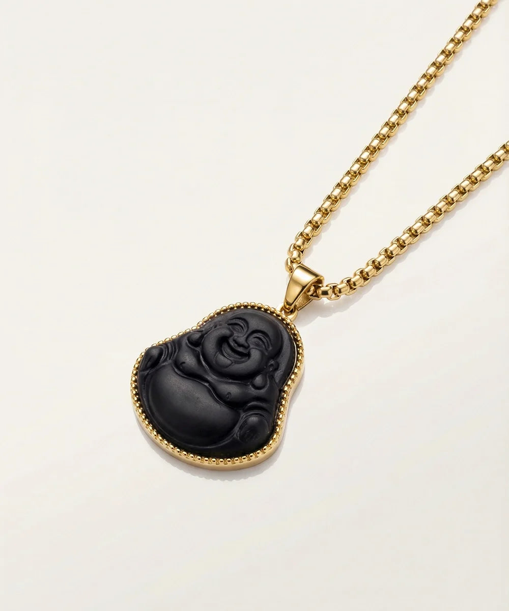 Close-up of matte yellow Buddha pendant