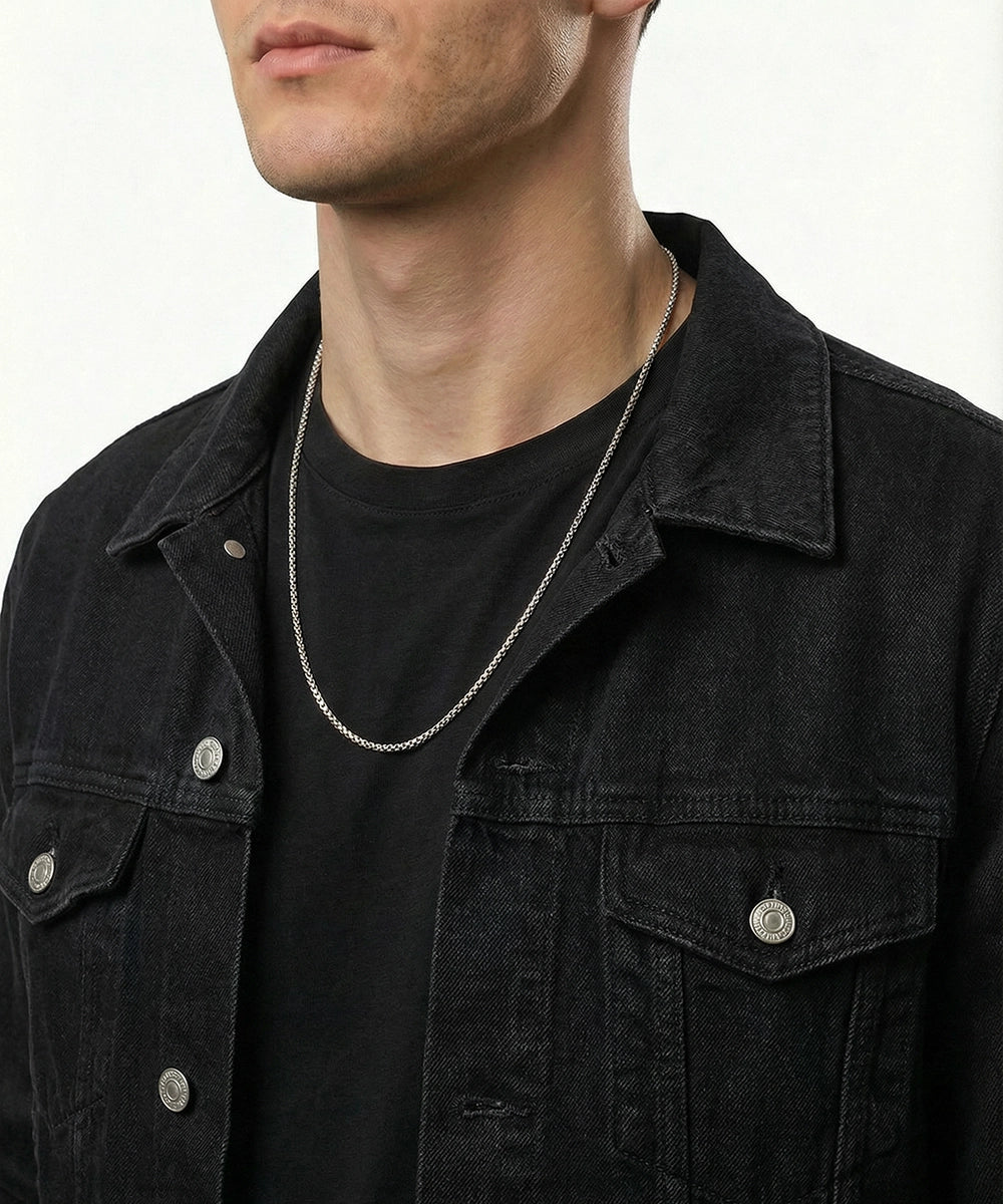 men's silver-toned stainless steel box chain necklace on model wearing black denim jacket