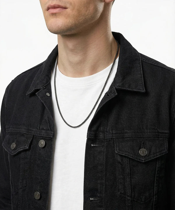 men's black stainless steel box chain necklace on model wearing black denim jacket