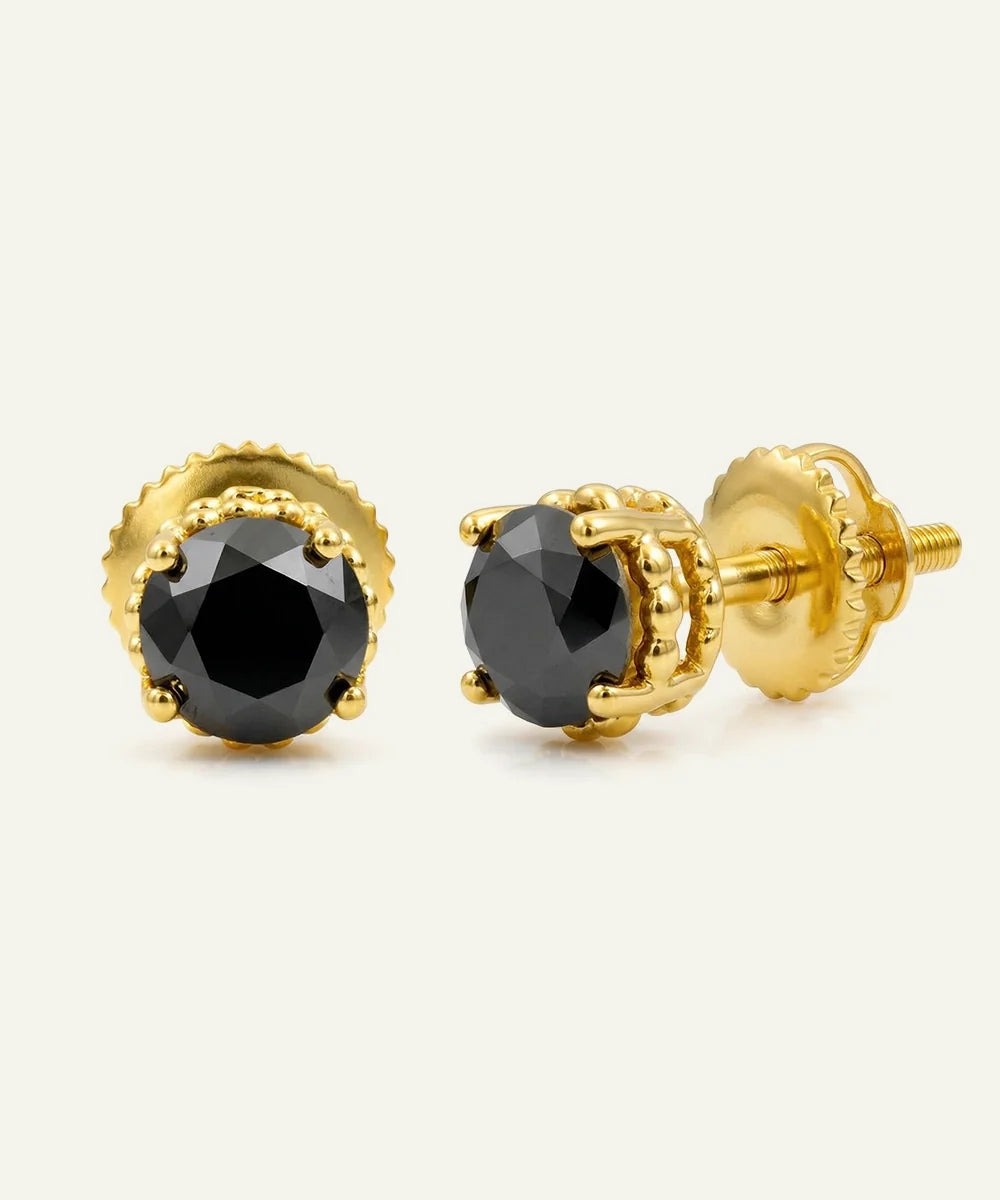 Close-up of round black diamond studs in vermeil
