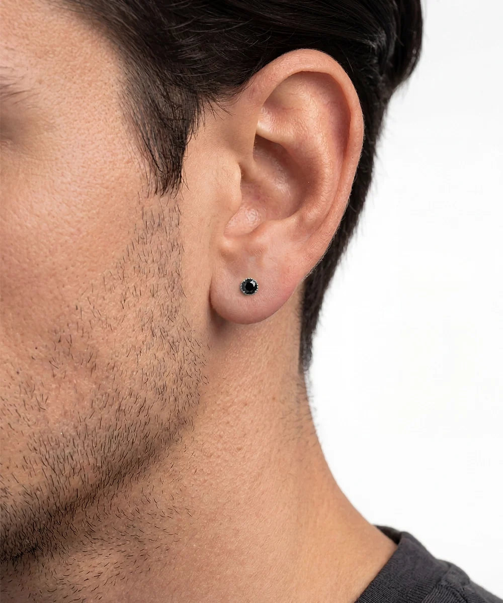 Side view of silver black diamond stud earrings