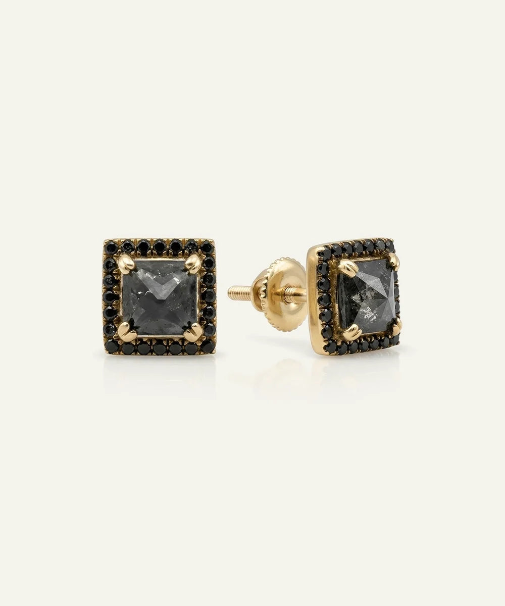 Close-up of men's princess-cut black diamond halo studs in vermeil