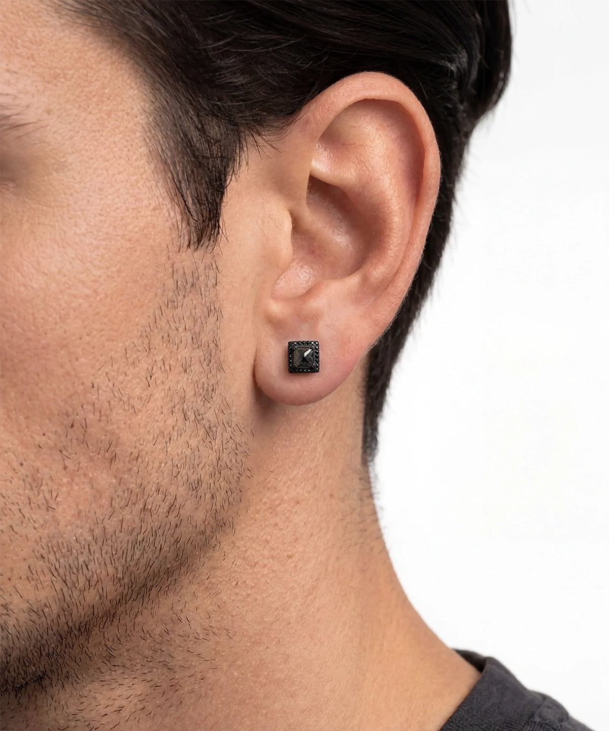 Front view of men's black diamond halo stud earrings in black finish