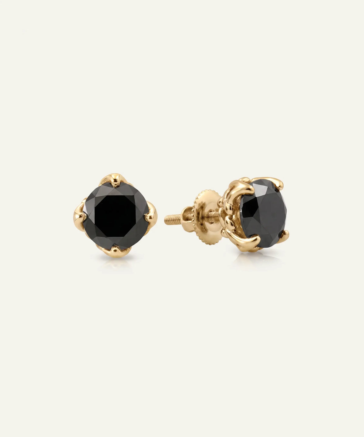 Close-up of men's black diamond solitaire studs in vermeil