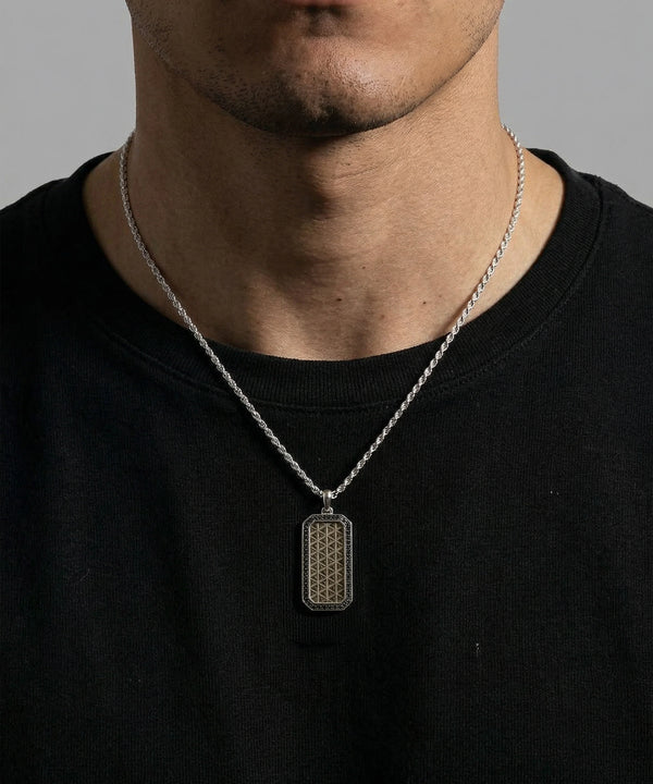 Close-up of black diamond dog tag pendant
