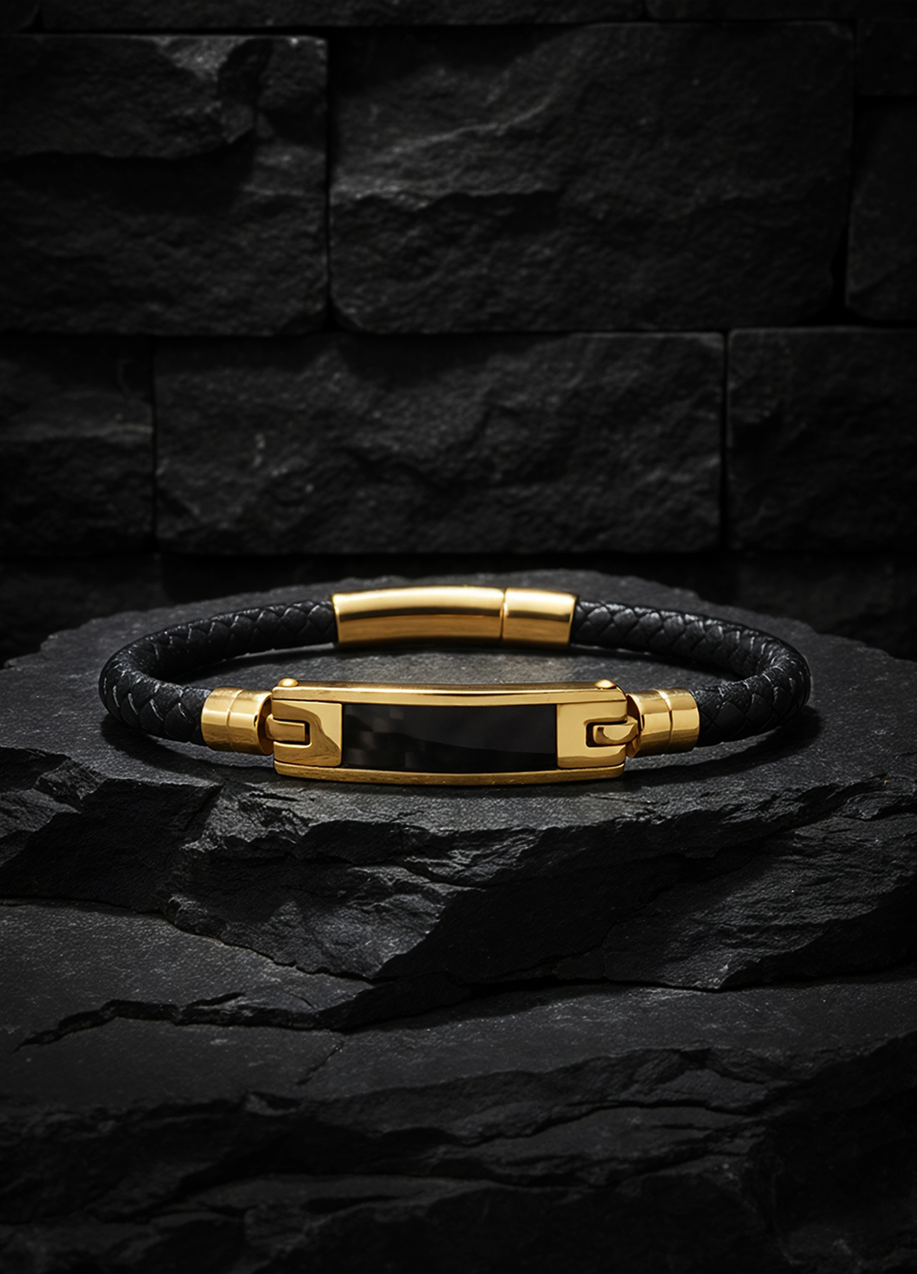 Black braided leather bracelet with gold-tone centerpiece